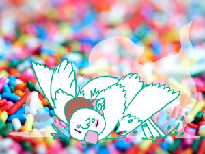 white bird takes a dust bath in sprinkles