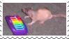 a naked rat playing a tiny toy piano stamp